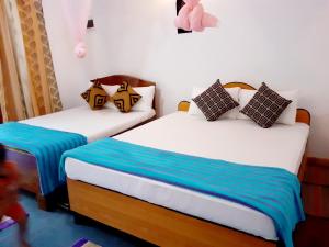 Postel nebo postele na pokoji v ubytování Chamathka homestay