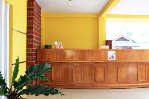 a court room with a wooden court bench at Super OYO 1722 Villa Ciparay Indah Syariah in Garut