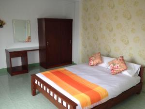 Un pat sau paturi într-o cameră la Baan Mitreejit