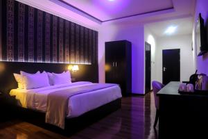 Voodi või voodid majutusasutuse BON Hotel Ikeja Residence toas