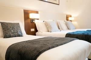 Letto o letti in una camera di Archi di Roma Guest House