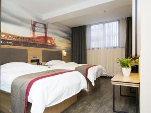 Postel nebo postele na pokoji v ubytování Thank Inn Plus Hotel Shanghai Qingpu District Hongqiao National Exhibition Center Xujing North City