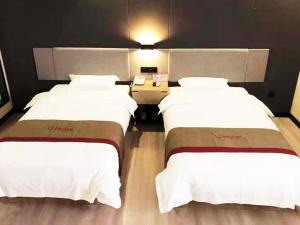 Katil atau katil-katil dalam bilik di Thank Inn Plus Hotel Hebei Shijiazhuang Zhengding New District International Small Commodity City