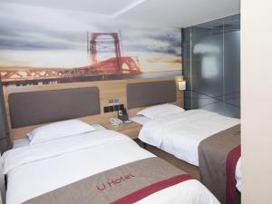 Postel nebo postele na pokoji v ubytování Thank Inn Plus Hotel Shanghai Qingpu District Hongqiao National Exhibition Center Xujing North City