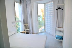 Postel nebo postele na pokoji v ubytování Loop INN Hostel Cartagena