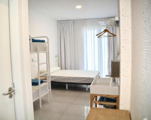 Postel nebo postele na pokoji v ubytování Loop INN Hostel Cartagena