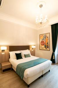 Giường trong phòng chung tại Archi di Roma Guest House