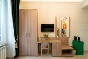 TV o dispositivi per l'intrattenimento presso Archi di Roma Guest House