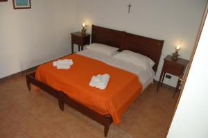 Voodi või voodid majutusasutuse Hotel Al Togo Fitness & Relax toas