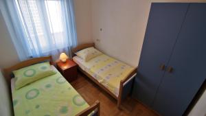 Posteľ alebo postele v izbe v ubytovaní Apartments Marusic