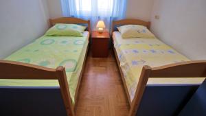 Posteľ alebo postele v izbe v ubytovaní Apartments Marusic