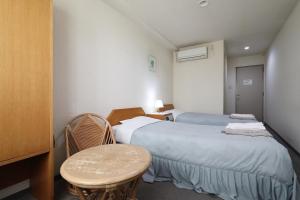 Postel nebo postele na pokoji v ubytování Hotel Tensui