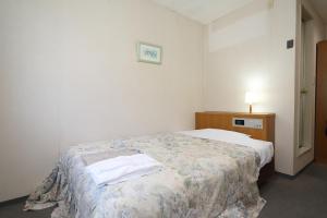 Postel nebo postele na pokoji v ubytování Hotel Tensui