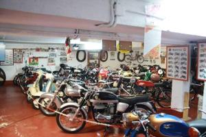 a bunch of motorcycles parked in a garage at Hotel Restaurante La Parra in La Franca