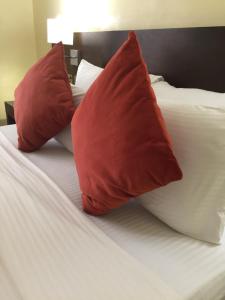 Ένα ή περισσότερα κρεβάτια σε δωμάτιο στο AMOR Hotels Ekiti