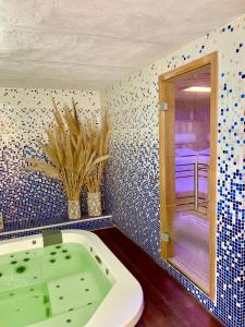 a bathroom with a bath tub and a window at Alqueria de Vilches in Cullera