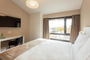 Voodi või voodid majutusasutuse Hotel Lo! im Kreuz Jona toas