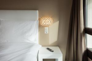 Voodi või voodid majutusasutuse Hotel Lo! im Kreuz Jona toas