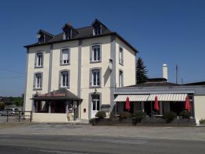 a large white building on the side of a street at Le Gue de Genes in Ambrieres Les Vallees