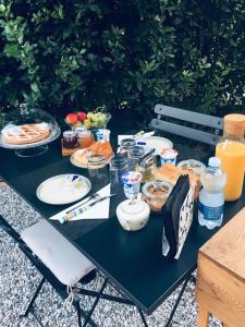 a picnic table with food and drinks on it at ML32 in Ravenna