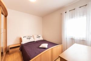 Postel nebo postele na pokoji v ubytování Apartments Karen + 37 fotografií