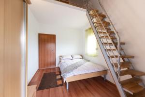 Postel nebo postele na pokoji v ubytování Apartments Karen