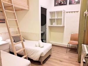 Postel nebo postele na pokoji v ubytování Itaca Hostel