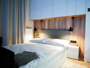 Posteľ alebo postele v izbe v ubytovaní ONE Apartamenty Gąsiorowskich 4
