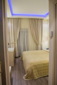 Postel nebo postele na pokoji v ubytování Pantelidis Hotel & Spa
