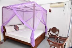 Katil atau katil-katil dalam bilik di Relax Inn Hikkaduwa