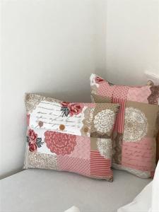 a couple of pillows sitting next to each other at BorászPorta - Présház in Villány