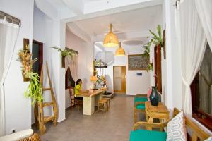 a living room with a table and chairs at Parvati Retreat Villas in Ubud