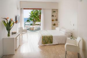 Voodi või voodid majutusasutuse Hotel Caravelle Thalasso & Wellness toas