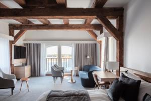 a hotel room with a bed and a table and chairs at Copenhagen Admiral Hotel in Copenhagen