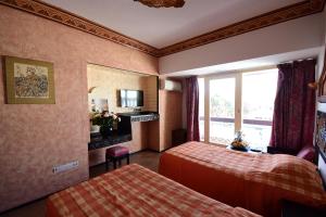 Rúm í herbergi á Sud Bahia Agadir "Bahia City Hotel"