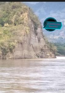 a blue frisbee flying over a body of water at Brisas del Magdalena in La Dorada