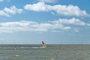 a sail boat in the ocean on the water at KNAUS Campingpark Dorum in Dorum Neufeld