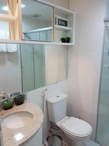 a bathroom with a toilet and a sink at Aparthotel BSB Flats in Brasilia +41 photos