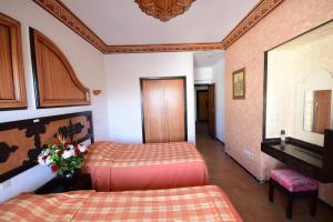 Rúm í herbergi á Sud Bahia Agadir "Bahia City Hotel"