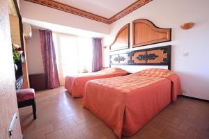 Rúm í herbergi á Sud Bahia Agadir "Bahia City Hotel"
