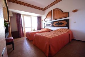 Rúm í herbergi á Sud Bahia Agadir "Bahia City Hotel"