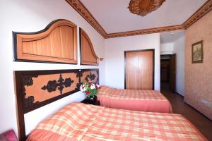 Rúm í herbergi á Sud Bahia Agadir "Bahia City Hotel"