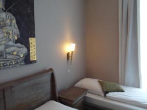 Postel nebo postele na pokoji v ubytování Hotel Commodore