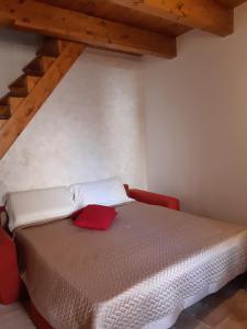Postel nebo postele na pokoji v ubytování La casetta nel claustro