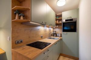 a kitchen with a wooden counter top with a sink at Oberstdorfer Bergwelt 246 in Oberstdorf