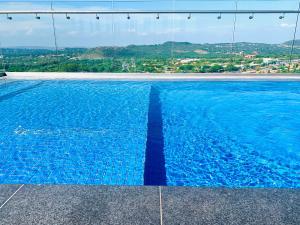 a swimming pool with a view of a city at Menlyn Maine Residences - Napoli with king sized bed in Pretoria