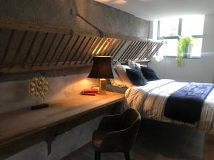 Un pat sau paturi într-o cameră la Matin de Saône
