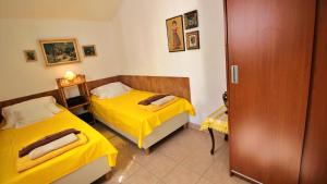 Posteľ alebo postele v izbe v ubytovaní Seaside Apartment