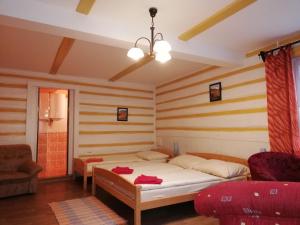 Uma cama ou camas num quarto em Pension Vladimír