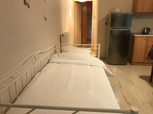 A bed or beds in a room at Διαμέρισμα 65 τμ στην καρδιά της πόλης
